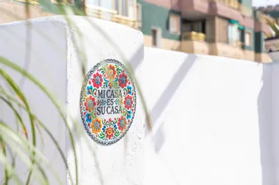 a sticker on the side of a white fence at Seaview Apartment N12 in El Perelló
