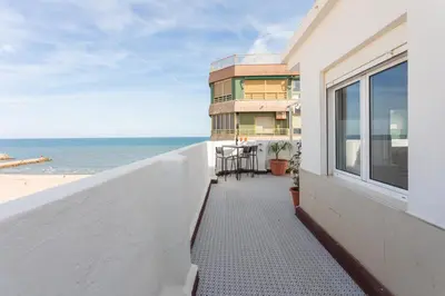 a balcony of a building with a view of the beach at Seaview Apartment N12 in El Perelló