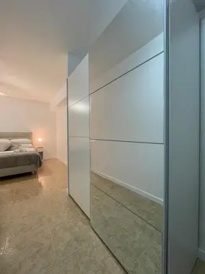 a sliding glass door in a bedroom with a bed at Valentia Rooms - Baleares in Valencia