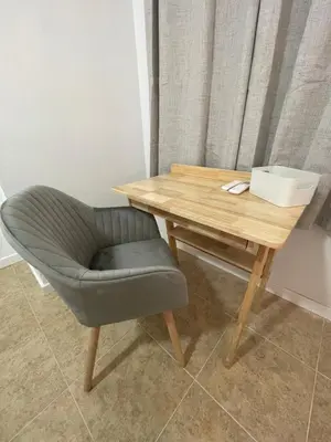 a wooden table with a chair next to a wooden desk at Valentia Rooms - Baleares in Valencia