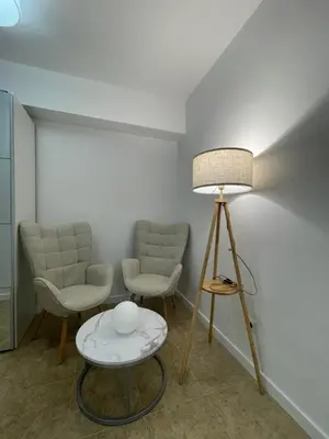 a room with two chairs and a table and a lamp at Valentia Rooms - Baleares in Valencia