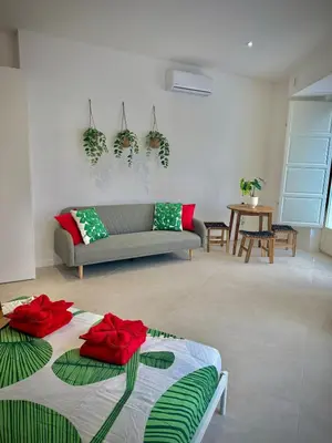 a living room with a couch and a table at Glamour Suite 2 next to the city center in Valencia