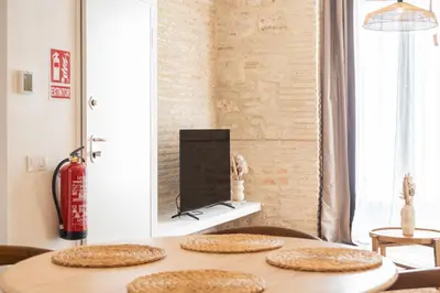 a room with a table with four straw hats on it at Yturralde by Alma Suites in Valencia