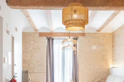 a room with a window and a chandelier at Yturralde by Alma Suites in Valencia