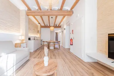 a living room with a couch and a table at Yturralde by Alma Suites in Valencia