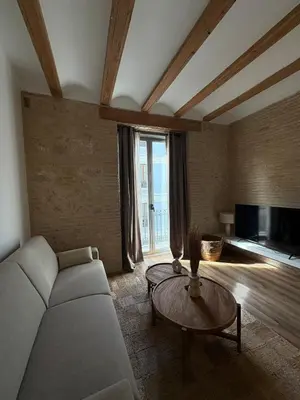 a living room with a couch and a table at Yturralde by Alma Suites in Valencia