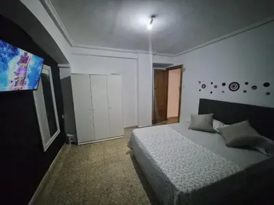 a bedroom with a bed in a room at democracia delux in Valencia