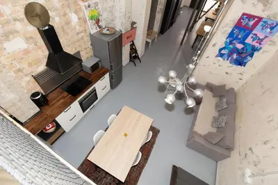 an overhead view of a kitchen and living room with a table and chairs at GuestReady - Urban Loft in Valencia in Valencia
