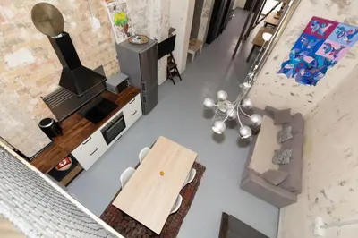 an overhead view of a kitchen and living room with a table at GuestReady - Urban Loft in Valencia in Valencia