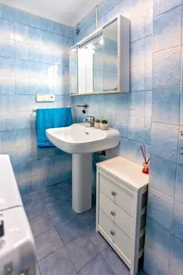 a bathroom with a white sink and a mirror at Florazar 2 Pool & Private Balcony in Cullera