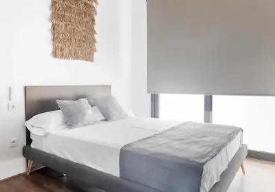 a bedroom with a large bed with two pillows at increible ubicación in Valencia