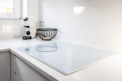 a white kitchen counter with a hair dryer on it at Duplex-Port-Valencia in Valencia