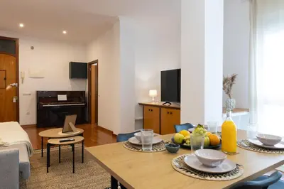 a living room with a table with food on it at Alojamiento Centrico para 6 Personas in Valencia
