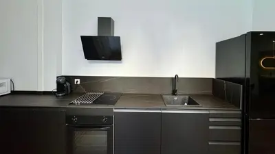 a kitchen with a sink and a counter top at Boutique Room - Vila Prades in Valencia