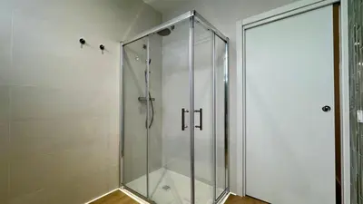 a shower with a glass door in a bathroom at Boutique Room - Vila Prades in Valencia