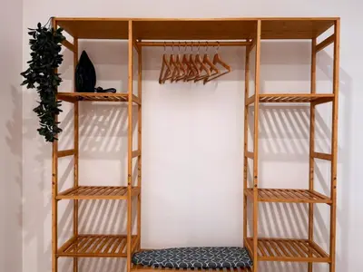 a closet with wooden shelving and a wall at Ruzafa & Oceanografic Suites by Illetes Flats in Valencia