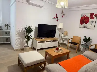 a living room with a couch and a tv in it at Precioso piso acerca de Estación Joaquín Sorolla in Valencia