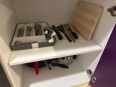 a white shelf with a bunch of tools on it at Precioso piso acerca de Estación Joaquín Sorolla in Valencia
