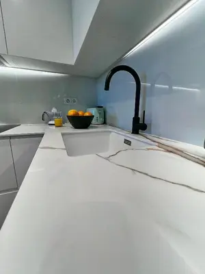 a kitchen with a sink and a bowl of oranges at Alameda Stay - Apartamento lujoso Ciudad de las Artes y las Ciencias in Valencia