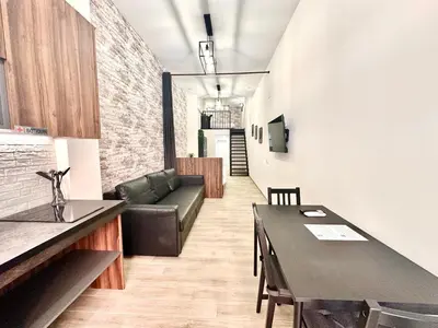 a living room with a couch and a table at Ciudades de España in Valencia