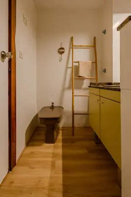 a small bathroom with a sink and a counter at Cabañal BeachFront , 1 Min to Sea , AC , Coffee , Balcony , FastWifi in Valencia
