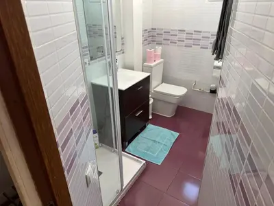 a bathroom with a toilet and a glass shower at Padre Antonio in Valencia