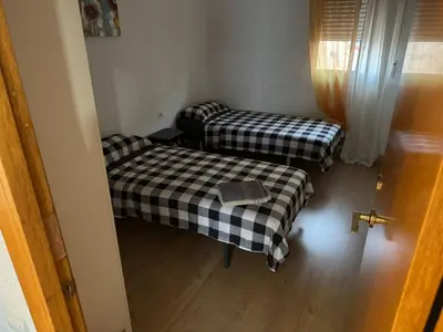 a room with two beds in a room at Padre Antonio in Valencia