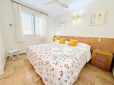 a bedroom with a large bed in a room at Villa en la Playa I 5BR I 5 WC I Piscina Privada in Sueca