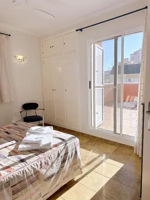 a bedroom with a bed and a large window at Villa en la Playa I 5BR I 5 WC I Piscina Privada in Sueca