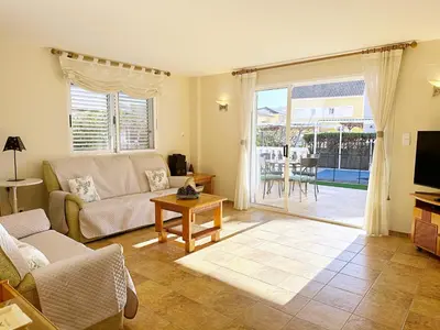 a living room with a couch and a table at Villa en la Playa I 5BR I 5 WC I Piscina Privada in Sueca