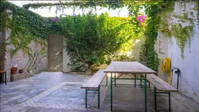 a living room with a couch and a table at House near beach w-terrace in Valencia