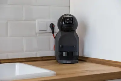 a blow dryer sitting on a counter in a kitchen at House near beach w-terrace in Valencia