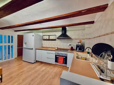 a kitchen with a white refrigerator and a sink at Duplex en el Carmen in Valencia