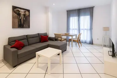 a living room with a couch and a table at Apartment Ruzafa Market 3C in Valencia