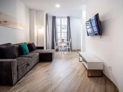 a living room with a couch and a table at Apartment Ruzafa Market 6B in Valencia
