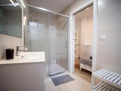 a bathroom with a shower and a sink and a glass door at Apartment Ruzafa Market 6B in Valencia