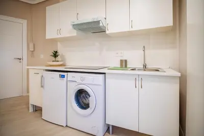 a kitchen with a washing machine and a sink at Apartment Ruzafa Market 6A in Valencia