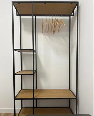 a black closet with wooden shelves and hangers at Habitacion privada con baño privado II in Valencia