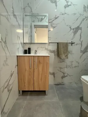 a bathroom with a sink and a mirror at Habitacion privada con baño privado II in Valencia