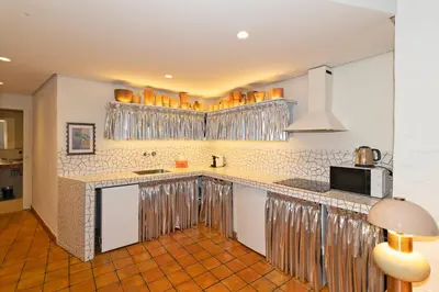 a kitchen with a counter top with a microwave at GuestReady - Stay near the Central Market in Valencia