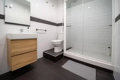 a bathroom with a shower and a toilet and a sink at Apartment Ruzafa Market 7B in Valencia