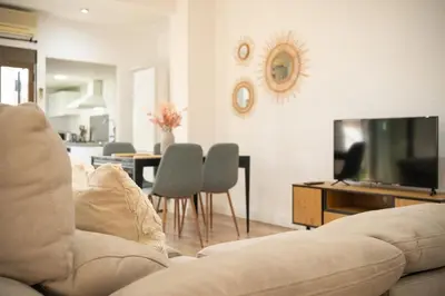 a living room with a couch and a flat screen tv at ChillOut Area 2BR 4P City Relax Fast WiFi Pet Friendly in Valencia