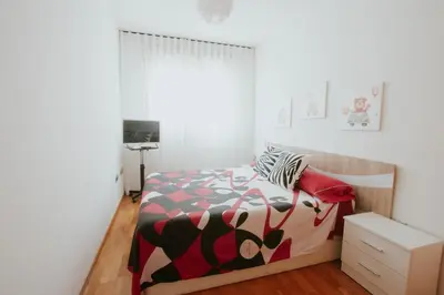 a bedroom with a bed with a colorful comforter at Family & Friends Apartment with Pool in Torrent