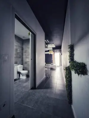 a bathroom with a toilet and a plant on the wall at Cozy Room G20 in Valencia