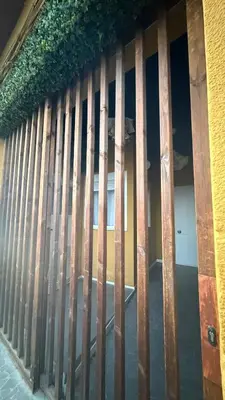 a wooden fence on the side of a building at Cozy Room G20 in Valencia