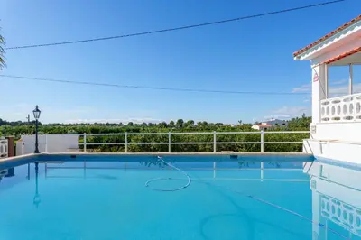 a swimming pool with a tennis ball in the middle at Masia Miliuca Paraíso rural a un paso de Valencia - Rural paradise close to Valencia in Bétera