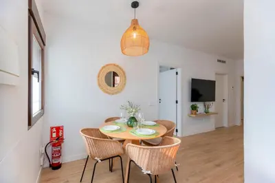 a dining room with a table and chairs at - Marés Cabanyal -Mediterráneo en clave boutique in Valencia