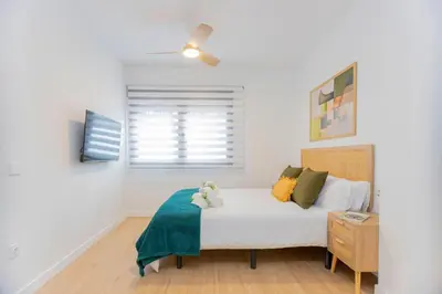 a bedroom with a bed and a window at - Marés Cabanyal -Mediterráneo en clave boutique in Valencia