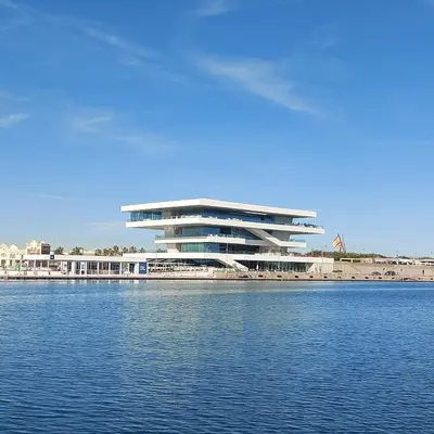 a large building next to a body of water at - Marés Cabanyal -Mediterráneo en clave boutique in Valencia