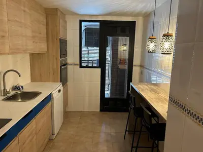 a kitchen with a sink and a counter top at Great apartment in Sciences City in Valencia